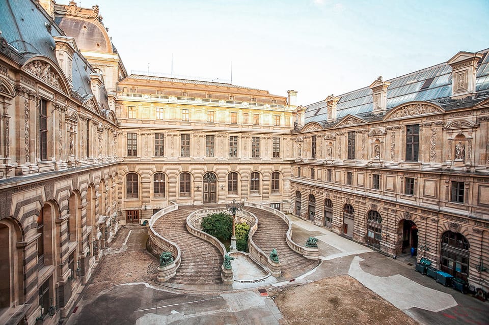 Amazing view from a Louvre Pyramid from a dark and moody day with rainy weather | SUPERPOBYT World