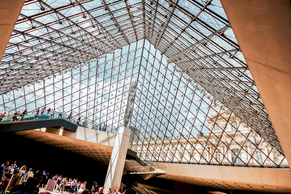 Amazing view from a Louvre Pyramid from a dark and moody day with rainy weather | SUPERPOBYT World